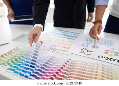 Design team choosing color palette for logo of the company