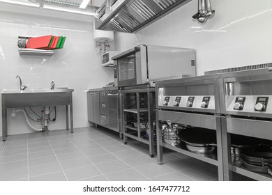 Design Of The Working Area Of The Commercial Cafe Kitchen With Stainless Steel Equipments, Hot Shop, Food Industry.