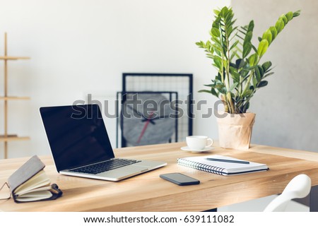 design of workplace in home office with modern equipment and objects