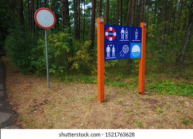 Designation Of The Nudisk And Public Beach On A Large Billboard, In The Resort Town, In Europe In The Summer Season