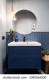 Designed Bathroom With Stylish Blue Cabinet And Blue Wall Tiles