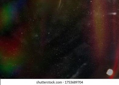 Designed film texture background with heavy grain, dust and a light leak Real Lens Flare Shot in Studio over Black Background. Easy to add as Overlay or Screen Filter over Photos overlay - Shutterstock ID 1753689704