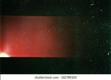 Designed film texture background with heavy grain, dust and a light leak - Shutterstock ID 242789203
