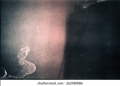 Designed film texture background with heavy grain, dust and a light leak