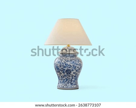 Designer blue pattern table lamp on the light blue background