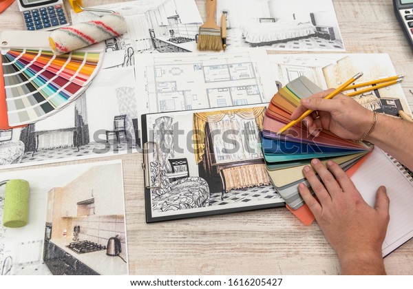 The designer chooses the perfect color\
for a new apartment. Sketch of a modern\
apartment