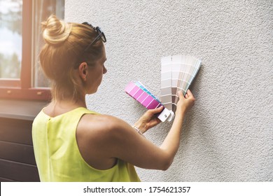 Designer Choosing Paint Color For House Exterior Stucco Facade