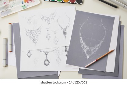 Designer design diamond jewelry drawing sketches making works craft unique handmade luxury necklaces product ideas.