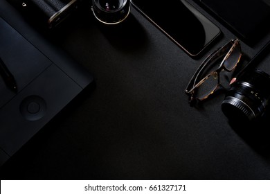 Designer desk mockup. Desk, Camera - Photographic Equipment, Smart Phone on dark top table. - Powered by Shutterstock