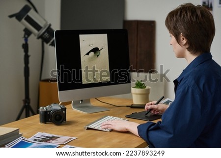 Designer editing photos on computer