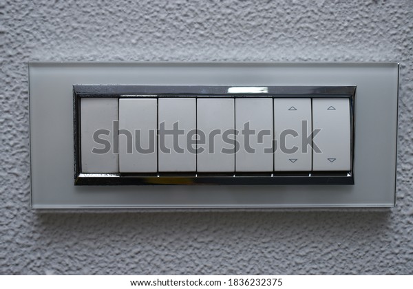 DESIGNER ELECTRICAL SWITCH BOARD on zinc paint\
wall with six switches
