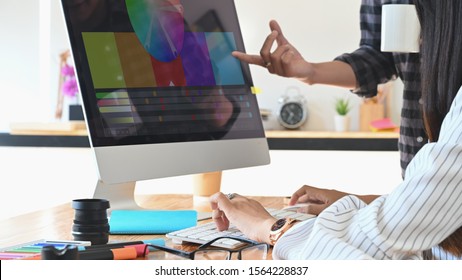 Designer graphic creative creativity work with colour wheel w in computer monitor, Discussion and planning concept.  - Powered by Shutterstock