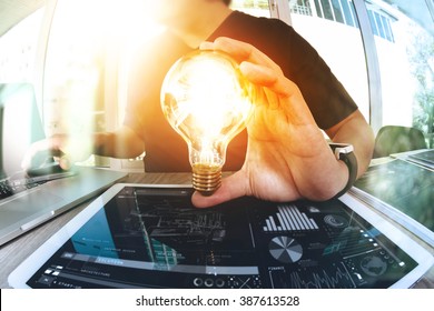 designer hand showing creative business strategy with light bulb as concept
