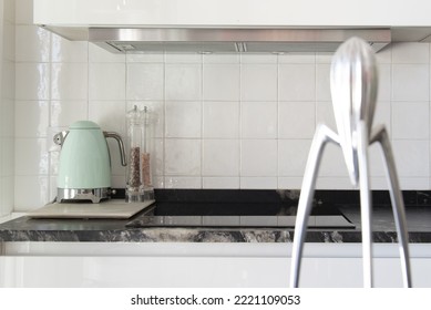 Designer Juicer And Small Appliances On Black Marble Countertop