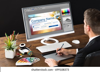 Designer Making Webpage Design On Computer Using Graphic Tablet - Powered by Shutterstock