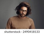 Designer, modern or portrait of man with glasses, vision or clear sight on grey background in studio. Prescription eyewear, face and confident male mode with fashion, health or cool spectacle frame