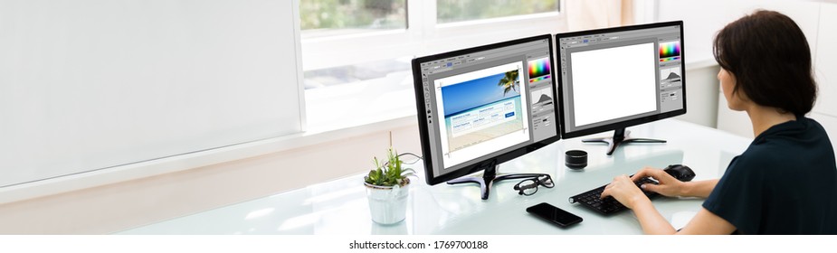 Designer Or Photographer Editing Photos On Multiple Computers