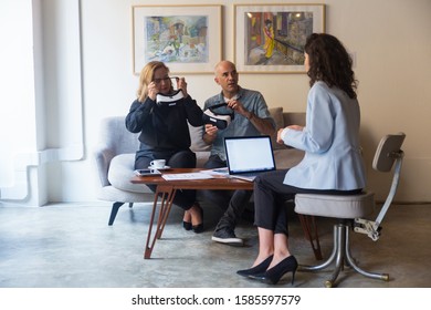 Designer presenting virtual interior project to customer. People using virtual reality technology at home. Renovation or VR glasses using concept - Powered by Shutterstock