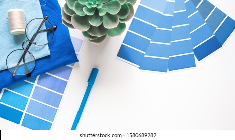 designer , seamstress desktop. Color sample guide blue. Color of the year 2020 pantone classic blue