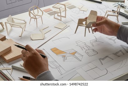 Designer sketching drawing design development product plan draft chair armchair Wingback Interior furniture prototype manufacturing production. designer studio concept .                           
