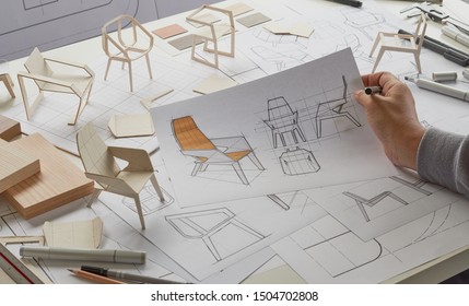 Designer Sketching Drawing Design Development Product Plan Draft Chair Armchair Wingback Interior Furniture Prototype Manufacturing Production. Designer Studio Concept .                           