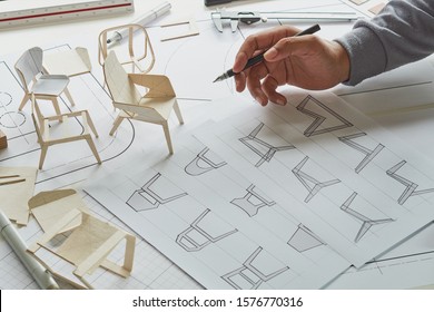 Designer Sketching Drawing Design Development Product Plan Draft Chair Armchair Wingback Interior Furniture Prototype Manufacturing Production. Designer Studio Concept .                           