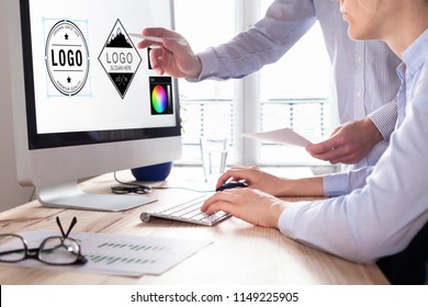 Designer team sketching a logo in digital design studio on computer, creative graphic drawing skills for marketing and branding - Shutterstock ID 1149225905