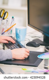 Designer using graphics tablet in the office