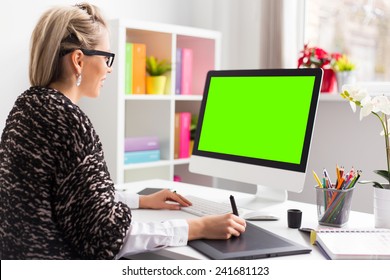 Designer Using Graphics Tablet While Working With Computer