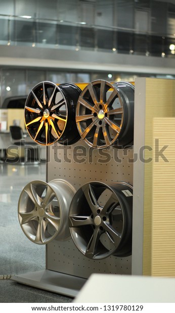 Designer Wheel Rims On The Rack In Automobile Service\
Center 