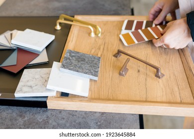 Designer Woman Choosing Details Of New Kitchen In A Home Improvement Store. Real Estate, Home Renovation, Small Business Concept