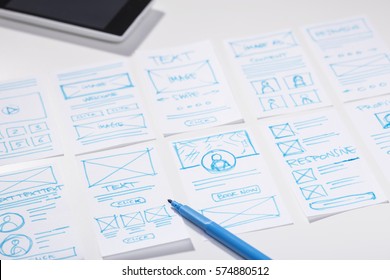 Designer Working Desk With Wireframe Sketches For Mobile Application, User Interface Design Process