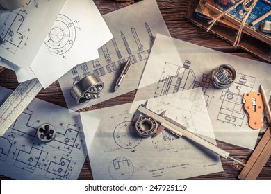 Designing mechanical parts by engineer - Shutterstock ID 247925119