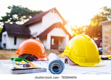 Desk of Architectural working project in construction site,With drawing equipmen