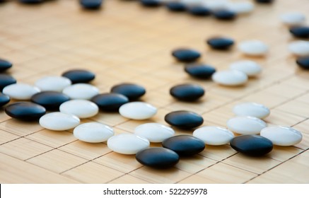 Desk For Board Game Go Or Wei-chi And Black And White Bones. Wei-chi - Traditional Asian Strategy Board Game, Shallow Depth Of Field