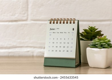 Desk calendar for June 2024. Desk calendar for planning, scheduling, assigning, organizing and managing every date - Powered by Shutterstock