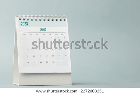 Desk calendar for the month of June 2023 with a blue-grey background