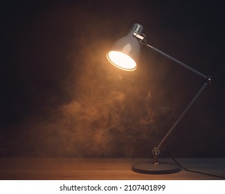 desk lamp in smoke, copy-space background