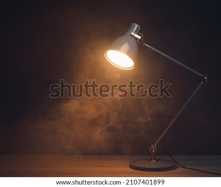 desk lamp in smoke, copy-space background