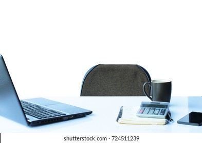 The Desk With Laptop And Pen With Book And A Cup Of Coffee On White Backgrounds