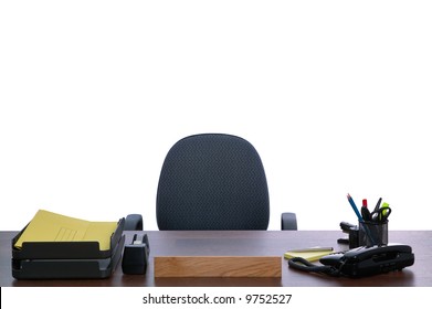 Desk With Nobody Sat At It, Against A White Background. Blank Name Sign To Add Your Own Text.