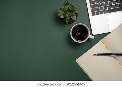 Desk office with blank notepad, coffee cup and pen on wood table. Flat lay top view copy space. - Shutterstock ID 2012561465