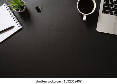desk office top view with computer,notepad, pen coffee and plant on black background. flat lay with copy space. - Shutterstock ID 1532362409