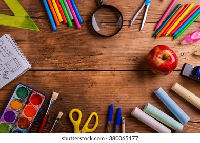 Desk With School Supplies Against Wooden Background, Copy Space