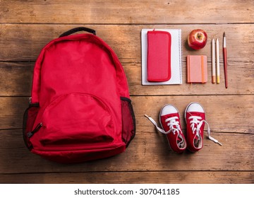 Desk with school supplies. Studio shot on wooden background.  - Powered by Shutterstock