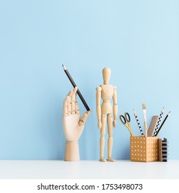 Desk With School Supplies And Wooden Accessories. Artist Workspace.