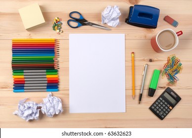 Desk With Sheet Of Paper And Stationery Objects Seen From Above