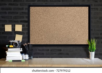 Desk Space Concept. Mock Up Cork Board, Vintage Camera And Films On Wood Table Workplace With Supplies. 