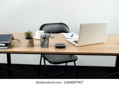 Desk for study work or freelance with note pad pen and laptop. Online learn concept - Shutterstock ID 2360007907
