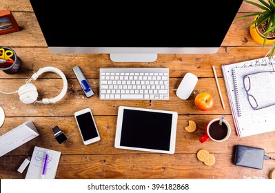 Desk with various gadgets and office supplies. Flat lay - Shutterstock ID 394182868